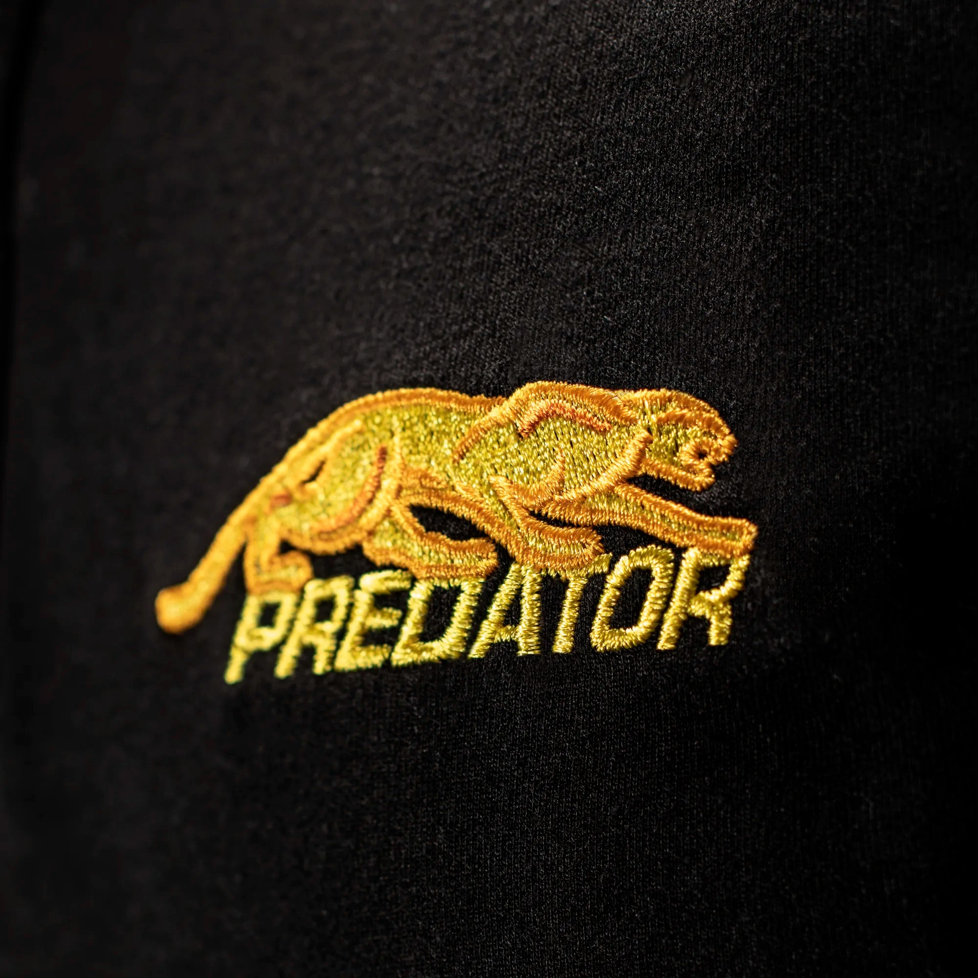 Gold embroidered PREDATOR logo