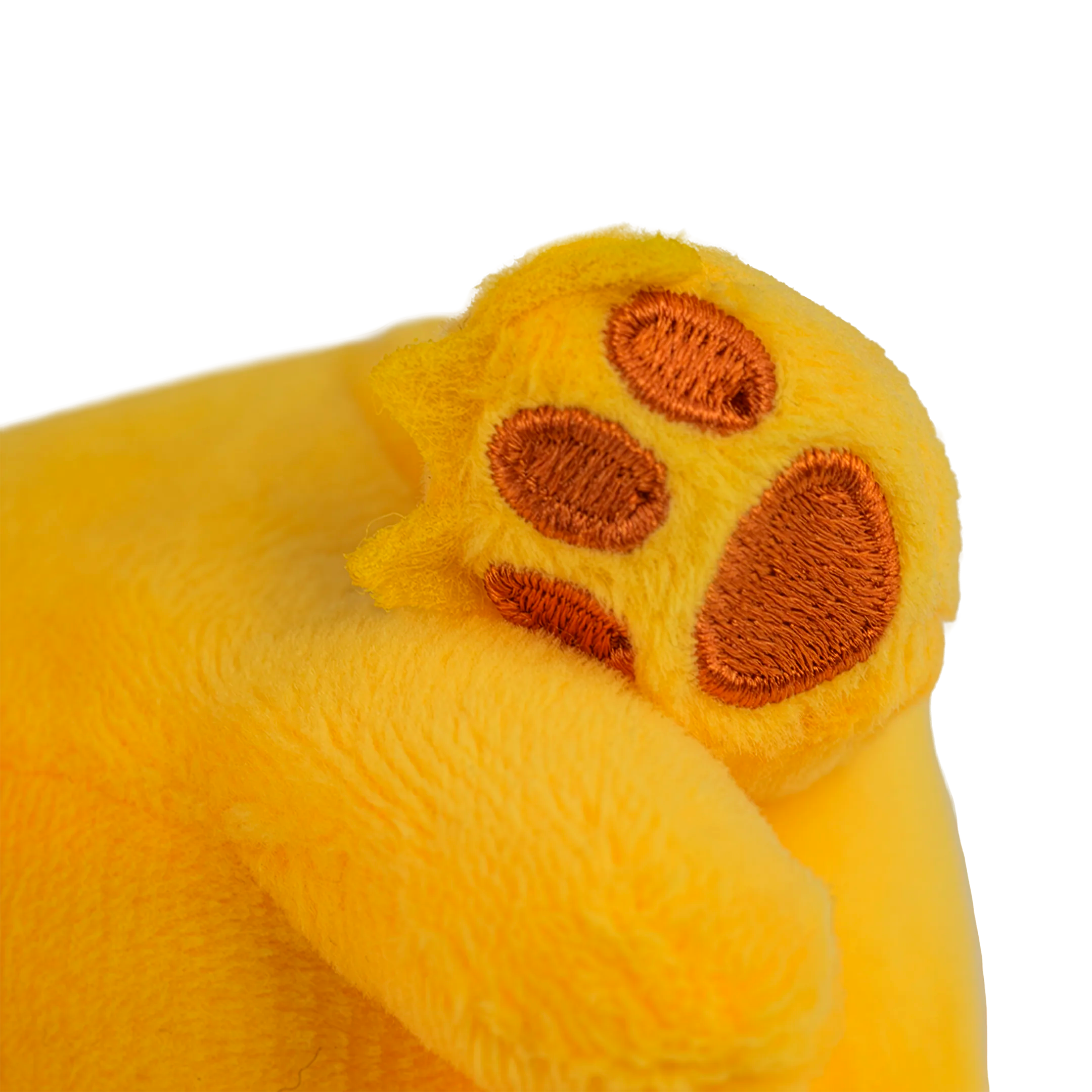 Close-up of a yellow plush toy paw with brown pads