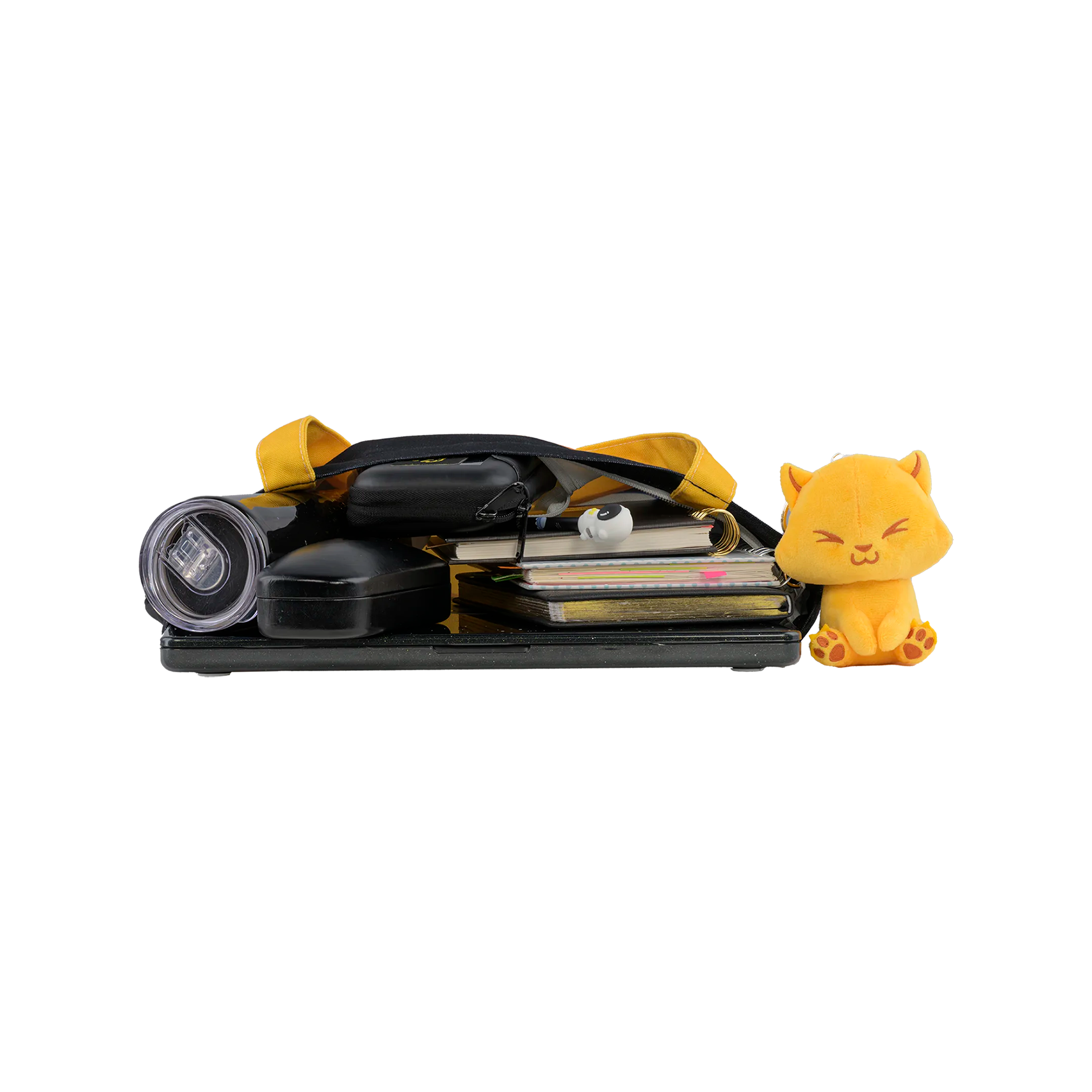 Collection of small items, including a yellow cat and notebook