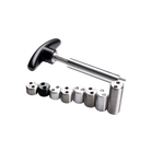Metal weight bolts ranging in size next to metal installation tool with black handle. 