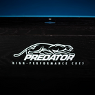 White cat logo with text: PREDATOR High-Performance Cues. Logo on wooden pool table. 