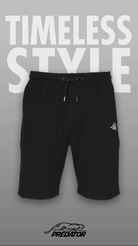 Rotating image of black drawstring shorts with white PREDATOR logo featuring TIMELESS STYLE text. 