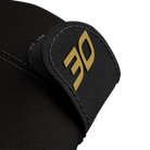 Close-up of black glove fabric with black glove lock featuring gold 30 logo on a white background.