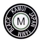 Kamui black cue tip front view with "Kamui Black Japan" and M hardness markings stamped.