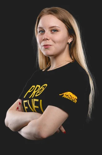 Woman wearing a black t-shirt with yellow text and logo on a black background