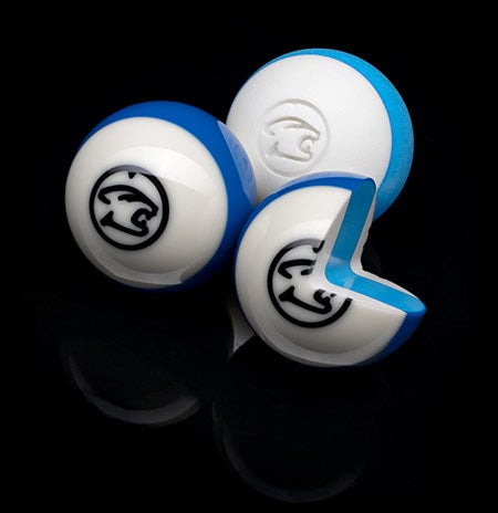 3 striped pool balls with one cut up to show the inside