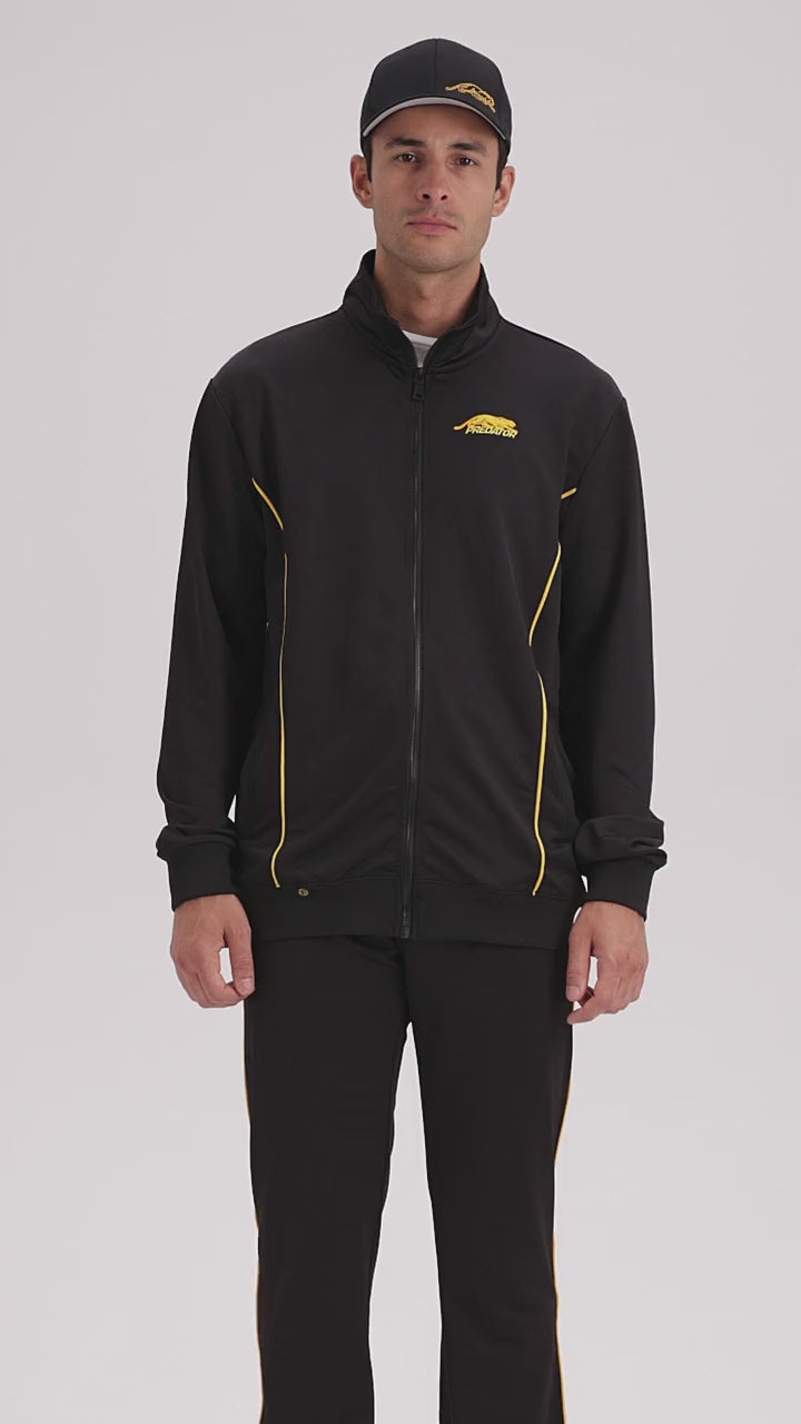 Video of a man wearing black pants and a jacket with a yellow stripe